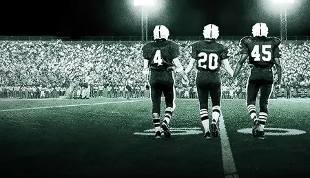 Friday night lights over a frosty high school field in the South